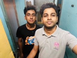 Casual photo of two people indoors